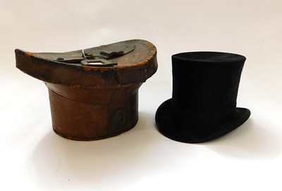 Lot 313 - A black silk top hat by Herbert Johnson, 38...