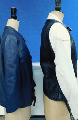 Lot 95 - Two leather jackets, one black and cream biker...