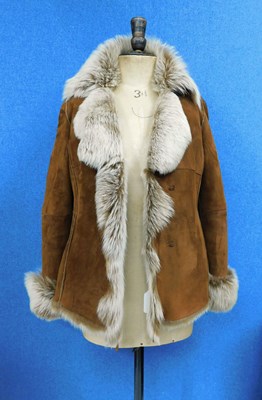 Lot 133 - A lady's tan sheepskin jacket by Higgs, with...