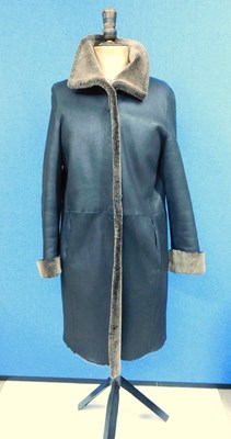 Lot 136 - A lady's coat by Higgs, the black and brown...