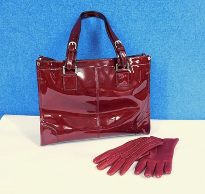 Lot 237 - A lady's red patent leather handbag by Jaeger...