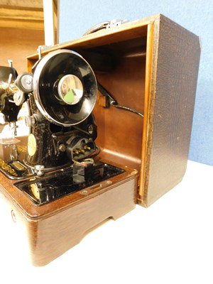 Lot 16 - A c.1934 knee operated Singer sewing machine,...