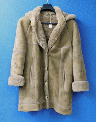 Lot 283 - A beige sheepskin coat by Cole of Kent, the...