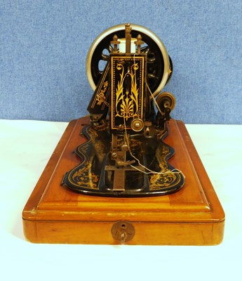 Lot 15 - An early 20th century Singer sewing machine,...