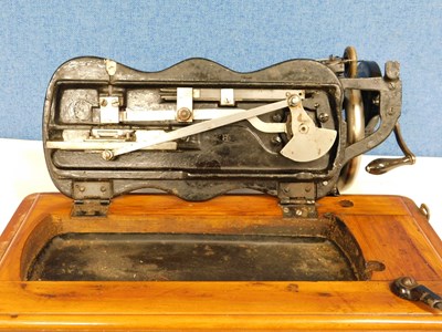 Lot 15 - An early 20th century Singer sewing machine,...