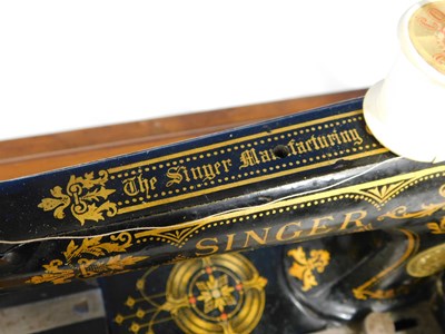 Lot 15 - An early 20th century Singer sewing machine,...