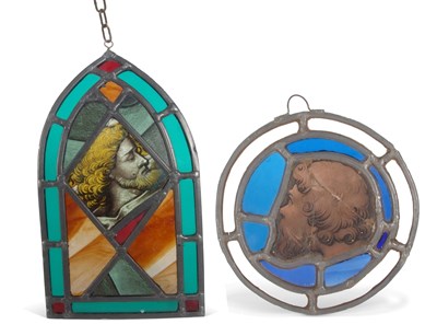 Lot 28 - A stained and leaded glass panel in the form...