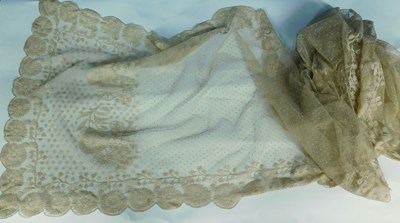 Lot 22 - A Nottingham lace shawl with scalloped floral...