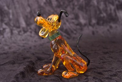 Lot 2 - A Swarovski Disney figure of Pluto with yellow...