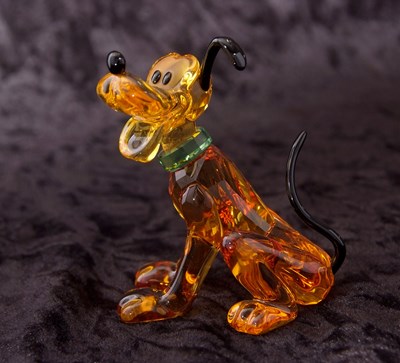 Lot 2 - A Swarovski Disney figure of Pluto with yellow...