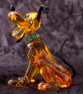 Lot 2 - A Swarovski Disney figure of Pluto with yellow...