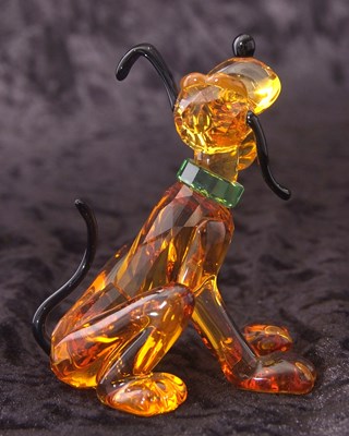 Lot 2 - A Swarovski Disney figure of Pluto with yellow...