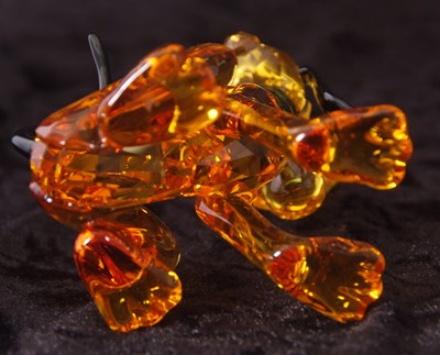 Lot 2 - A Swarovski Disney figure of Pluto with yellow...