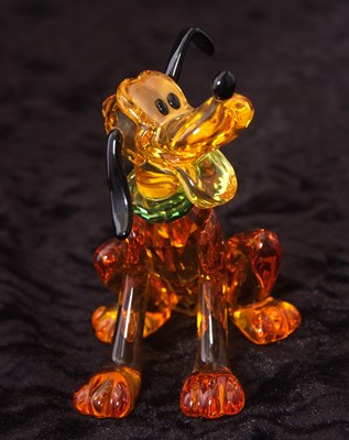 Lot 2 - A Swarovski Disney figure of Pluto with yellow...
