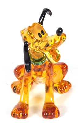 Lot 2 - A Swarovski Disney figure of Pluto with yellow...