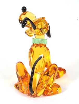 Lot 2 - A Swarovski Disney figure of Pluto with yellow...