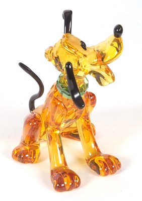Lot 2 - A Swarovski Disney figure of Pluto with yellow...