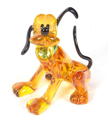 Lot 2 - A Swarovski Disney figure of Pluto with yellow...