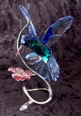 Lot 8 - A Swarovski model of a hummingbird in blue and...