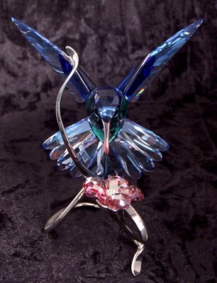 Lot 8 - A Swarovski model of a hummingbird in blue and...
