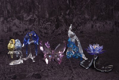 Lot 10 - A group of Swarovski coloured models of a pair...