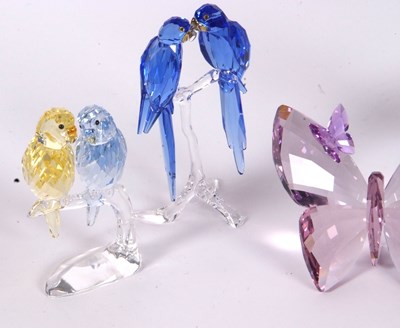 Lot 10 - A group of Swarovski coloured models of a pair...