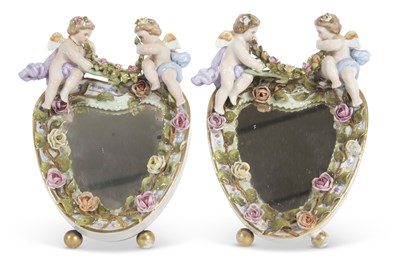 Lot 26 - An oval mirror in continental porcelain frame,...