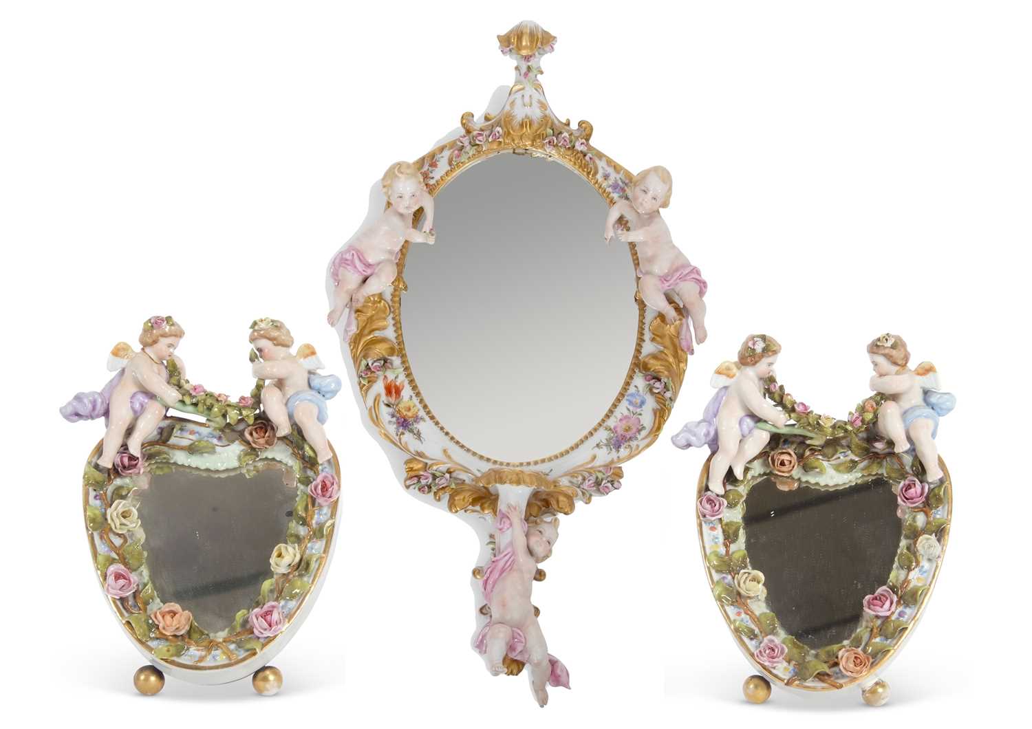 Lot 26 - An oval mirror in continental porcelain frame,...