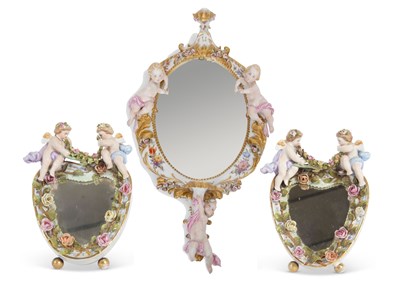 Lot 26 - An oval mirror in continental porcelain frame,...