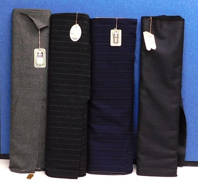 Lot 335 - Four bolts of assorted suiting fabric,...