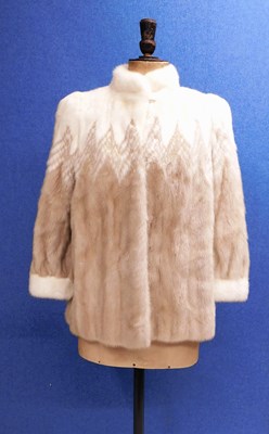 Lot 169 - A lady's fur jacket, the cream and beige brown...
