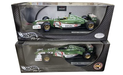 Lot 214 - A pair of boxed Hotwheels 1:18 scale model...
