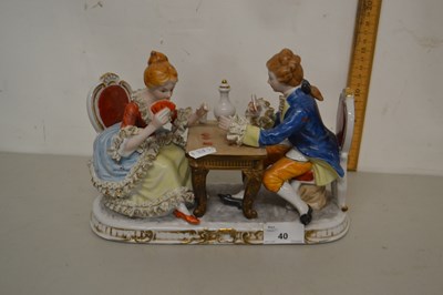 Lot 40 - A continental porcelain model of a couple...