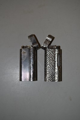 Lot 92 - Two Dunhill silver plated lighters with...