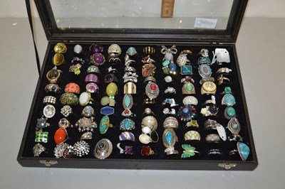 Lot 114 - A display case with various costume jewellery,...