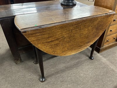 Lot 467 - A George III mahogany drop leaf dining table...