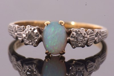 Lot 1 - An 18ct and platinum opal and diamond ring,...