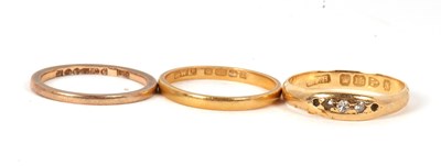 Lot 54 - Three gold rings: an 18ct diamond ring,...