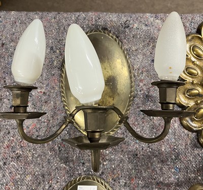 Lot 301 - A pair of 20th Century brass three branch wall...