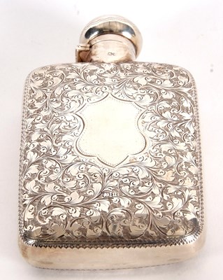 Lot 1 - A late Victorian spirit flask chased and...