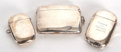 Lot 12 - A group of three silver vesters, two of plain...