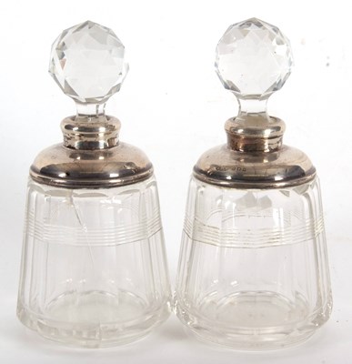 Lot 14 - A pair of glass scent bottles and stoppes with...