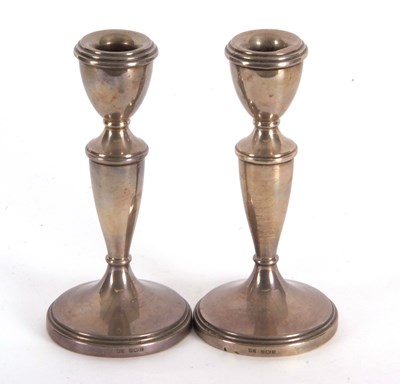 Lot 22 - A pair of Elizabeth II silver candle sticks of...