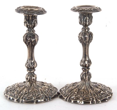 Lot 61 - A pair of late Victorian silver candlesticks,...
