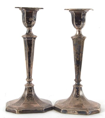 Lot 93 - A pair of Edwardian candlesticks having...