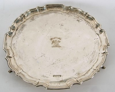 Lot 100 - A George V silver salver having a pie crust...