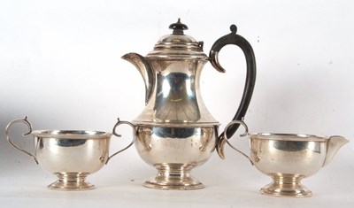 Lot 102 - A three piece George V tea service of plain...