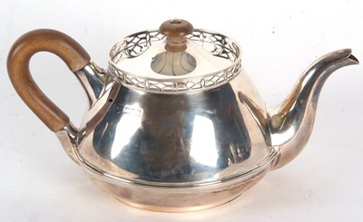 Lot 163 - A George V silver teapot of squat circular...