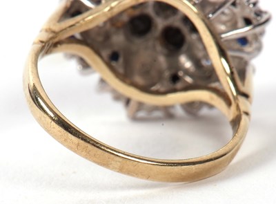 Lot 5 - A 9ct sapphire and diamond cluster ring, the...