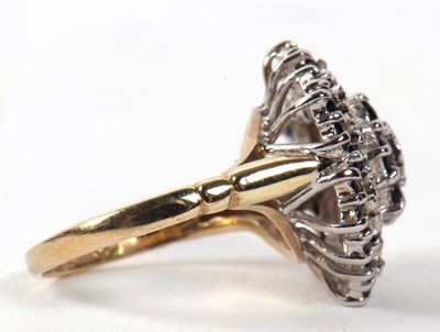 Lot 5 - A 9ct sapphire and diamond cluster ring, the...